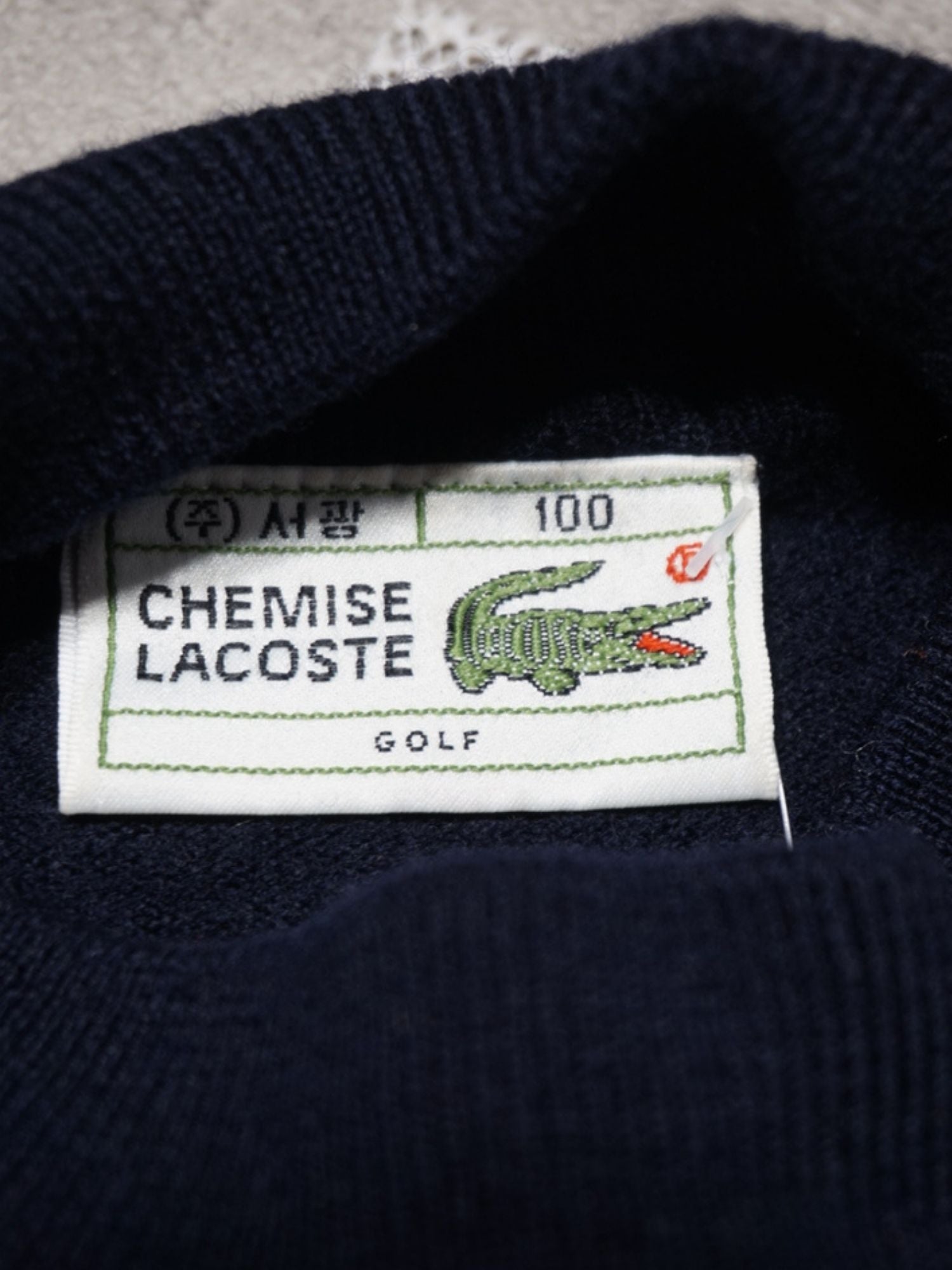 Pull col roulé bleu marine Lacoste (S femme)